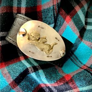 Leather cuff , cherub theme, 6 1/4” wrist